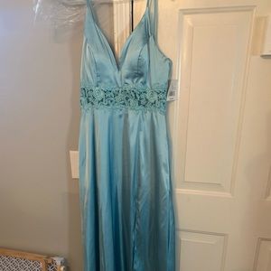 New with tags, full length light blue prom dress.